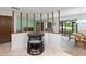 Eat-in kitchen with a round table and chairs, offering a cozy spot for breakfast or casual meals at 501 Fairways Ln # A, Ocala, FL 34472