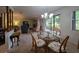 Inviting dining area with chandelier and view to the living room at 501 Fairways Ln # A, Ocala, FL 34472