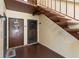 Condo entrance featuring staircase access and secure door access at 501 Fairways Ln # A, Ocala, FL 34472