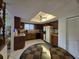 A kitchen with wood cabinets, white tile floor, and black appliances at 501 Fairways Ln # A, Ocala, FL 34472
