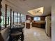 Eat-in kitchen boasts ceiling fan and tiled floors, adjoining dining and cooking spaces at 501 Fairways Ln # A, Ocala, FL 34472