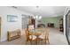 Bright living and dining room combo with neutral carpet and light colored walls at 501 Fairways Ln # A, Ocala, FL 34472