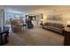 Open-concept living space with living room, dining area, and pass-through to kitchen at 501 Fairways Ln # A, Ocala, FL 34472