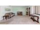 Cozy living room with neutral carpet, a comfortable sofa, decorative furnishings, and a bright window at 501 Fairways Ln # A, Ocala, FL 34472