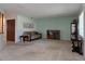 Cozy living room features neutral carpet and a decorative display cabinet at 501 Fairways Ln # A, Ocala, FL 34472