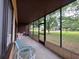 Spacious screened-in patio with a table and chairs, perfect for enjoying the outdoor view at 501 Fairways Ln # A, Ocala, FL 34472