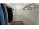 Walk-in closet with shelving and hanging rods for efficient storage at 501 Fairways Ln # A, Ocala, FL 34472
