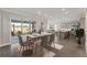 Dining area with table set for six and sliding glass doors, offering an indoor-outdoor flow at 5567 Nw 45Th Ln, Ocala, FL 34482