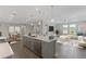 Open floor plan featuring modern kitchen with stainless steel appliances and view of the stylish living area at 5567 Nw 45Th Ln, Ocala, FL 34482