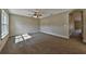 Neutral bedroom with gray carpet, ceiling fan, and window view at 5590 Sw 172Nd Loop, Ocala, FL 34473