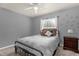 Comfortable bedroom with carpet, ceiling fan, and window with natural light at 5781 Sw 39Th St, Ocala, FL 34474