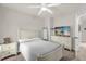 Bright bedroom with soft decor, dresser with television, and comfortable bed at 5781 Sw 39Th St, Ocala, FL 34474