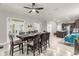 Dining area next to kitchen offers open layout, large table, and modern finishes at 5781 Sw 39Th St, Ocala, FL 34474
