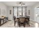 Bright dining room featuring a large table, neutral walls, and contemporary decor at 5781 Sw 39Th St, Ocala, FL 34474