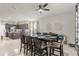 Open-concept dining area with large table, ceiling fan, and kitchen in the background at 5781 Sw 39Th St, Ocala, FL 34474