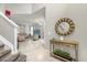 Bright entryway featuring modern decor, an elegant mirror, and an open view into the spacious living area at 5781 Sw 39Th St, Ocala, FL 34474