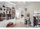 Inviting entryway featuring a large bookcase, neutral walls and decorative items at 5781 Sw 39Th St, Ocala, FL 34474