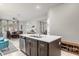 Kitchen with island and seating opens to the dining and living areas, ideal for entertaining at 5781 Sw 39Th St, Ocala, FL 34474