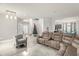 Spacious living room with neutral decor, a large sectional sofa, and an open layout at 5781 Sw 39Th St, Ocala, FL 34474