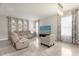 Bright living room features stylish furniture, neutral colors, and ample natural light at 5781 Sw 39Th St, Ocala, FL 34474