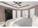 Comfortable main bedroom with ceiling fan, television, and closet access at 5781 Sw 39Th St, Ocala, FL 34474