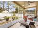 Enjoy the outdoors on this screened-in patio with comfortable seating and backyard views at 5781 Sw 39Th St, Ocala, FL 34474