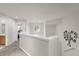 Upstairs landing with neutral walls, carpet, and view of sitting area at 5781 Sw 39Th St, Ocala, FL 34474