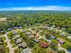 Aerial view of a single-Gathering home in a lush, green neighborhood at 5877 Sw 103Rd St, Ocala, FL 34476