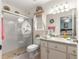 Bathroom with updated shower, vanity, and views of the main bedroom area at 5877 Sw 103Rd St, Ocala, FL 34476