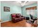 Bedroom offers comfortable seating with a plush leather sofa and office space at 5877 Sw 103Rd St, Ocala, FL 34476