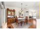 Traditional dining room has a wood china cabinet and table with chandelier at 5877 Sw 103Rd St, Ocala, FL 34476