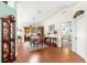 Comfortable dining area with wood flooring and access to the kitchen and additional living spaces at 5877 Sw 103Rd St, Ocala, FL 34476