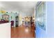 Inviting foyer showcasing hardwood floors and an open layout that flows into the dining and living areas at 5877 Sw 103Rd St, Ocala, FL 34476