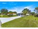 This home has a manicured lawn, and a long driveway at 5877 Sw 103Rd St, Ocala, FL 34476