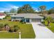 Charming single-story home with manicured front yard and two car garage at 5877 Sw 103Rd St, Ocala, FL 34476
