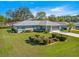Well-maintained one-story home featuring manicured landscaping and an attached two-car garage at 5877 Sw 103Rd St, Ocala, FL 34476