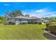 Home with well-manicured lawn and mature landscaping at 5877 Sw 103Rd St, Ocala, FL 34476