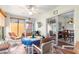 This sunroom has tile flooring, ceiling fan, and sliding doors leading to the dining room at 5877 Sw 103Rd St, Ocala, FL 34476