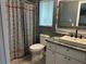 Bathroom featuring a modern design with decorative shower curtain, granite countertops, and a vessel sink at 6082 Sw 104Th St, Ocala, FL 34476