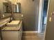 Bathroom featuring a sink with a granite countertop and modern fixtures at 6082 Sw 104Th St, Ocala, FL 34476