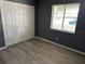 Bedroom features a closet, a window offering natural light and vinyl plank flooring at 6082 Sw 104Th St, Ocala, FL 34476