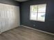 Bedroom features a closet, a window offering natural light and vinyl plank flooring at 6082 Sw 104Th St, Ocala, FL 34476