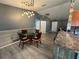 Cozy dining area features a modern light fixture and seating for four at 6082 Sw 104Th St, Ocala, FL 34476