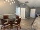 The dining area features a glass table and chairs, and unique wall design at 6082 Sw 104Th St, Ocala, FL 34476