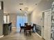 View of dining area with stylish chairs, modern light fixture, and wainscoting at 6082 Sw 104Th St, Ocala, FL 34476