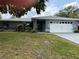 Charming single-story home with well-maintained landscaping and a two-car garage in a quiet neighborhood at 6082 Sw 104Th St, Ocala, FL 34476