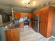Modern kitchen with stainless steel appliances and wooden cabinetry at 6082 Sw 104Th St, Ocala, FL 34476