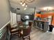 The spacious living area features modern flooring and a dining area with a glass table at 6082 Sw 104Th St, Ocala, FL 34476