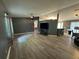 Bright living room with an open floor plan, gray walls, bar top, and luxury vinyl plank flooring at 6082 Sw 104Th St, Ocala, FL 34476