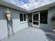 Covered patio area with seating and views of the surrounding landscape at 6082 Sw 104Th St, Ocala, FL 34476
